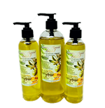 Three pump bottles of Exotic Liquid Gold body oil, filled with golden-yellow oil, with botanical labels, arranged against a black background. Three pump bottles of Exotic Liquid Gold body oil, filled with golden-yellow oil, with botanical labels, arranged against a black background.